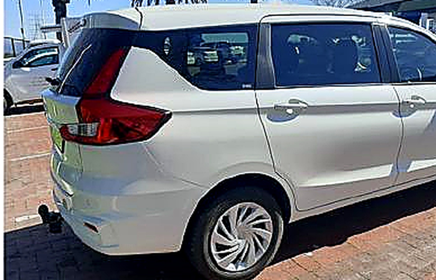 White 6-seater people mover, front view